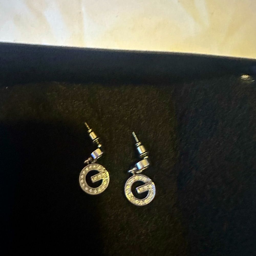 Guess earrings.